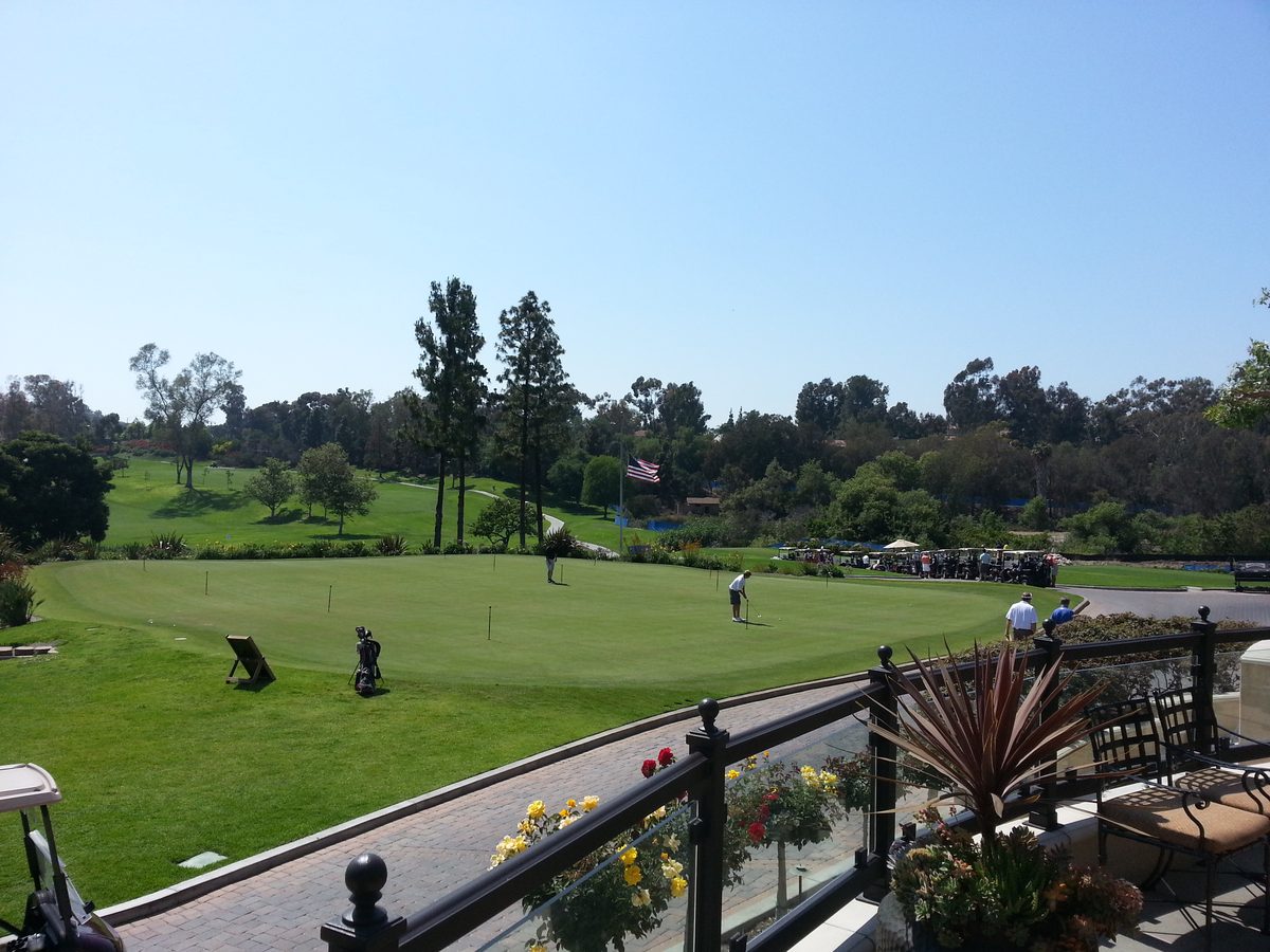 Green fairway and clubhouse patio at Mission Viejo Country Club